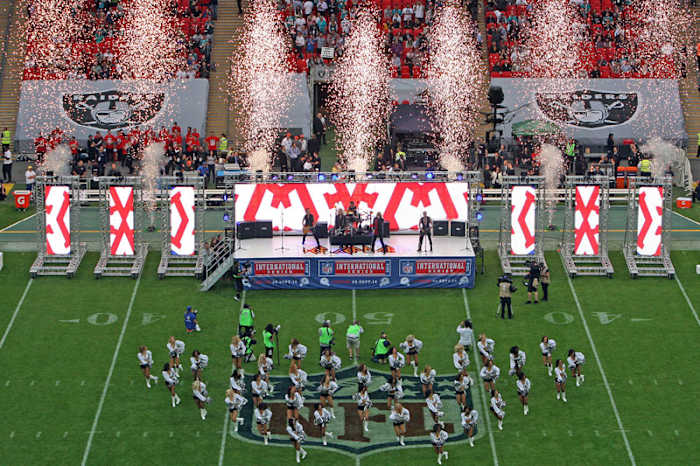 “The spectacle of it all, it’s over the top,“ says one English critic of the NFL who doesn’t go in for cheerleaders, explosions and Def Leppard at his sports event. (Nicky Hayes/NFL UK/Getty Images)